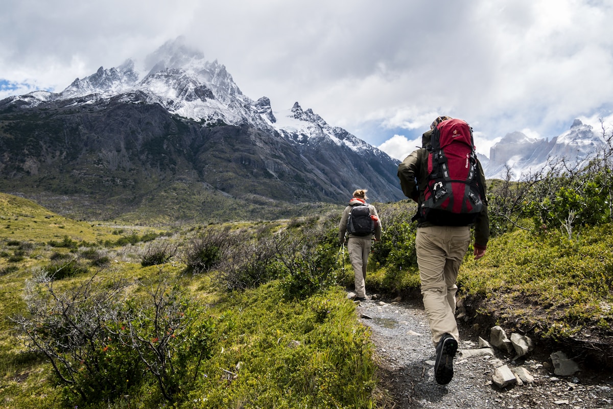 Hiker ascending a Colorado 14er trail with mountain views